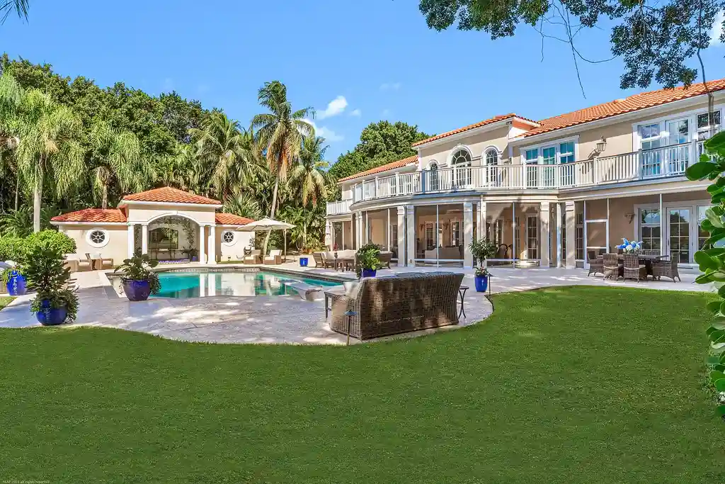 $13.5 Million Luxury Wellington Estate Featuring Private Tennis Court, Pool, and Equestrian Amenities 15 Outdoor pool and cabana at 2359 Muir Circle, Wellington, surrounded by manicured gardens and private tennis court