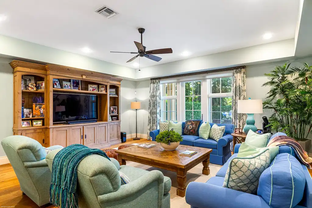 $13.5 Million Luxury Wellington Estate Featuring Private Tennis Court, Pool, and Equestrian Amenities 8 Outdoor pool and cabana at 2359 Muir Circle, Wellington, surrounded by manicured gardens and private tennis court