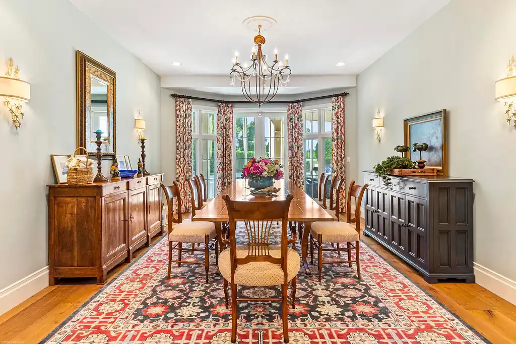 $13.5 Million Luxury Wellington Estate Featuring Private Tennis Court, Pool, and Equestrian Amenities 10 Outdoor pool and cabana at 2359 Muir Circle, Wellington, surrounded by manicured gardens and private tennis court