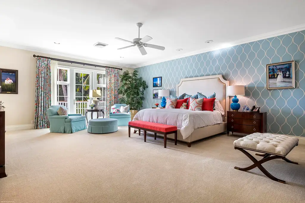 $13.5 Million Luxury Wellington Estate Featuring Private Tennis Court, Pool, and Equestrian Amenities 12 Outdoor pool and cabana at 2359 Muir Circle, Wellington, surrounded by manicured gardens and private tennis court