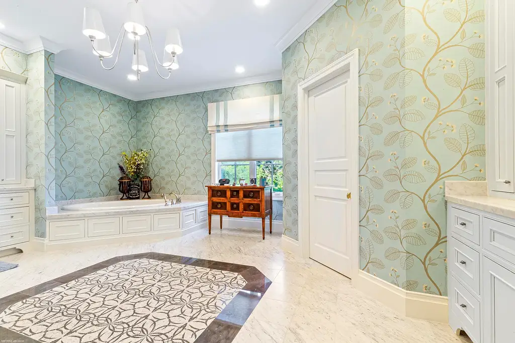 $13.5 Million Luxury Wellington Estate Featuring Private Tennis Court, Pool, and Equestrian Amenities 13 Outdoor pool and cabana at 2359 Muir Circle, Wellington, surrounded by manicured gardens and private tennis court