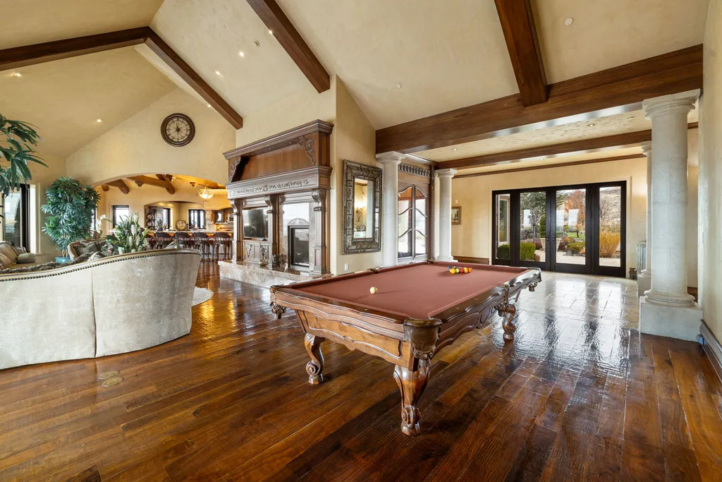 The Pennington Mansion at 2490 Manzanita Ln Hits the Market for $13,950,000, Introducing One of Reno’s Most Spectacular Trophy Estates 8 Billiards room at the Pennington Mansion featuring a polished wood floor classic pool table exposed beams and seamless flow into the adjacent living areas.