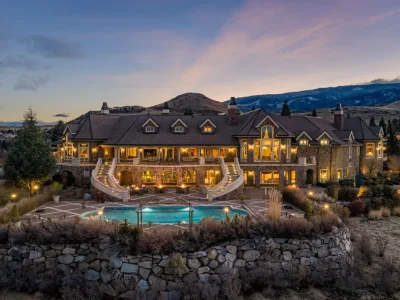 The Pennington Mansion at 2490 Manzanita Ln Hits the Market for $13,950,000, Introducing One of Reno’s Most Spectacular Trophy Estates 1 Aerial twilight view of the Pennington Mansion at 2490 Manzanita Ln in Reno Nevada showcasing its grand architecture, cascading staircases, and pool terrace against the Sierra landscape.