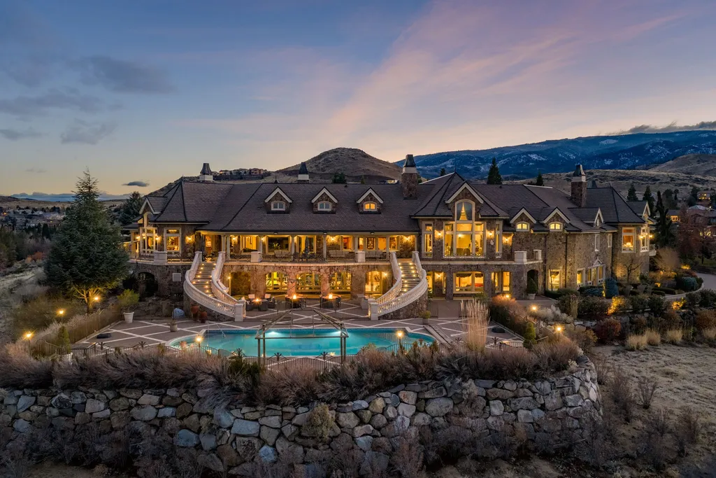 The Pennington Mansion at 2490 Manzanita Ln Hits the Market for $13,950,000, Introducing One of Reno’s Most Spectacular Trophy Estates 1 Aerial twilight view of the Pennington Mansion at 2490 Manzanita Ln in Reno Nevada showcasing its grand architecture, cascading staircases, and pool terrace against the Sierra landscape.