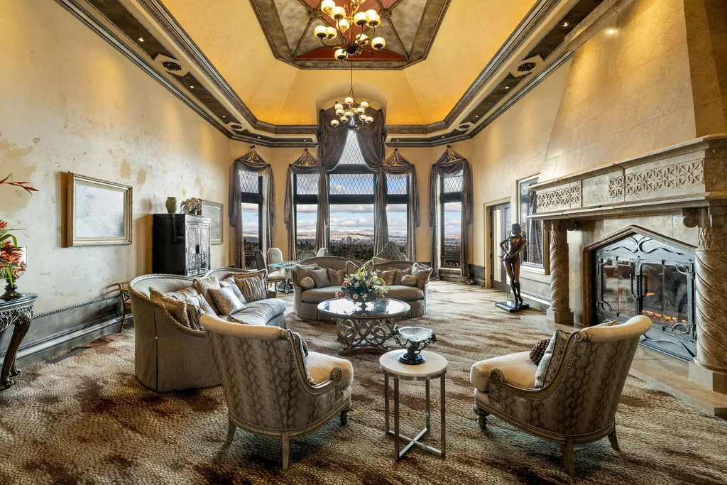 The Pennington Mansion at 2490 Manzanita Ln Hits the Market for $13,950,000, Introducing One of Reno’s Most Spectacular Trophy Estates 4 Formal living room at the Pennington Mansion featuring vaulted ceilings ornate millwork a grand stone fireplace and panoramic windows overlooking Reno.