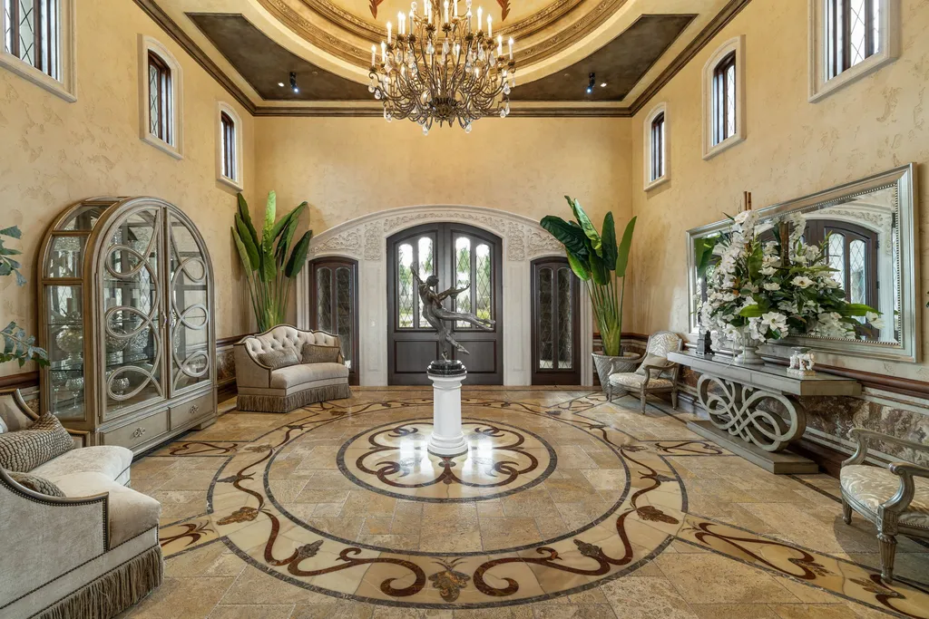 The Pennington Mansion at 2490 Manzanita Ln Hits the Market for $13,950,000, Introducing One of Reno’s Most Spectacular Trophy Estates 3 Grand rotunda entry at the Pennington Mansion featuring ornate inlaid stone flooring a central sculpture luxurious seating and a chandelier beneath a domed ceiling.