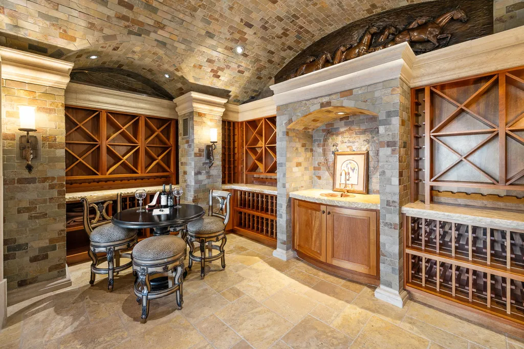 The Pennington Mansion at 2490 Manzanita Ln Hits the Market for $13,950,000, Introducing One of Reno’s Most Spectacular Trophy Estates 7 Wine cellar at the Pennington Mansion featuring arched brick ceilings custom wood racks tasting table and built in display niches.