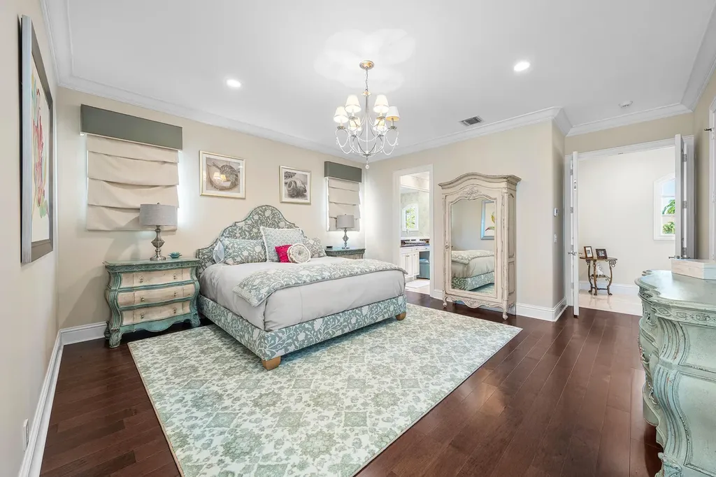 $12.5 Million Boca Raton Waterfront Estate Featuring Resort-Style Pool, and Private Dock 12 Resort-style backyard of Boca Raton estate featuring heated swimming pool, spa, outdoor lounge, and panoramic canal views