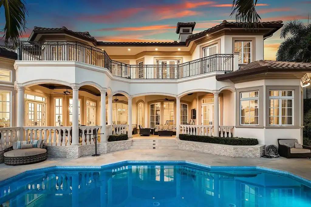 $12.5 Million Boca Raton Waterfront Estate Featuring Resort-Style Pool, and Private Dock 16 Resort-style backyard of Boca Raton estate featuring heated swimming pool, spa, outdoor lounge, and panoramic canal views