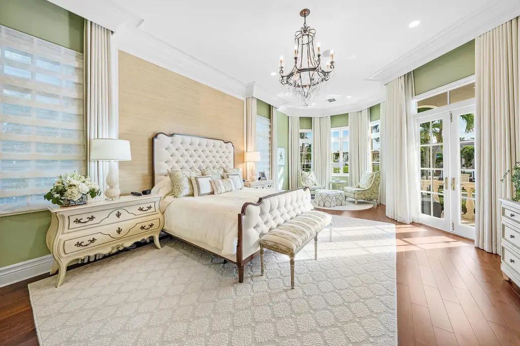 $12.5 Million Boca Raton Waterfront Estate Featuring Resort-Style Pool, and Private Dock 14 Resort-style backyard of Boca Raton estate featuring heated swimming pool, spa, outdoor lounge, and panoramic canal views