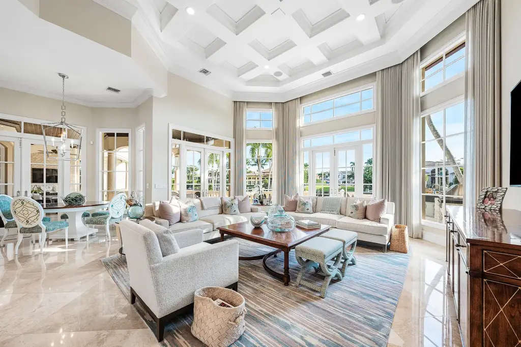 $12.5 Million Boca Raton Waterfront Estate Featuring Resort-Style Pool, and Private Dock 6 Resort-style backyard of Boca Raton estate featuring heated swimming pool, spa, outdoor lounge, and panoramic canal views