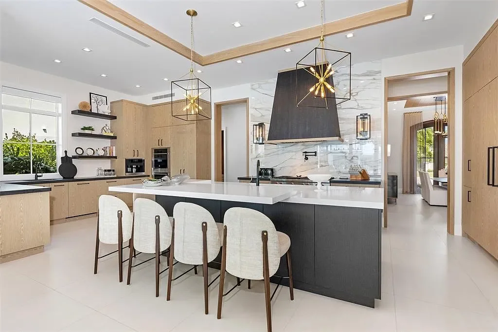 Ultra Luxury $28.4 Million Waterfront Estate Offering Exceptional Coastal Living in Fort Lauderdale 8 Luxurious waterfront exterior view of the modern estate at 2520 Del Lago Dr in Fort Lauderdale, showcasing the canal frontage, heated pool, and contemporary architectural design.