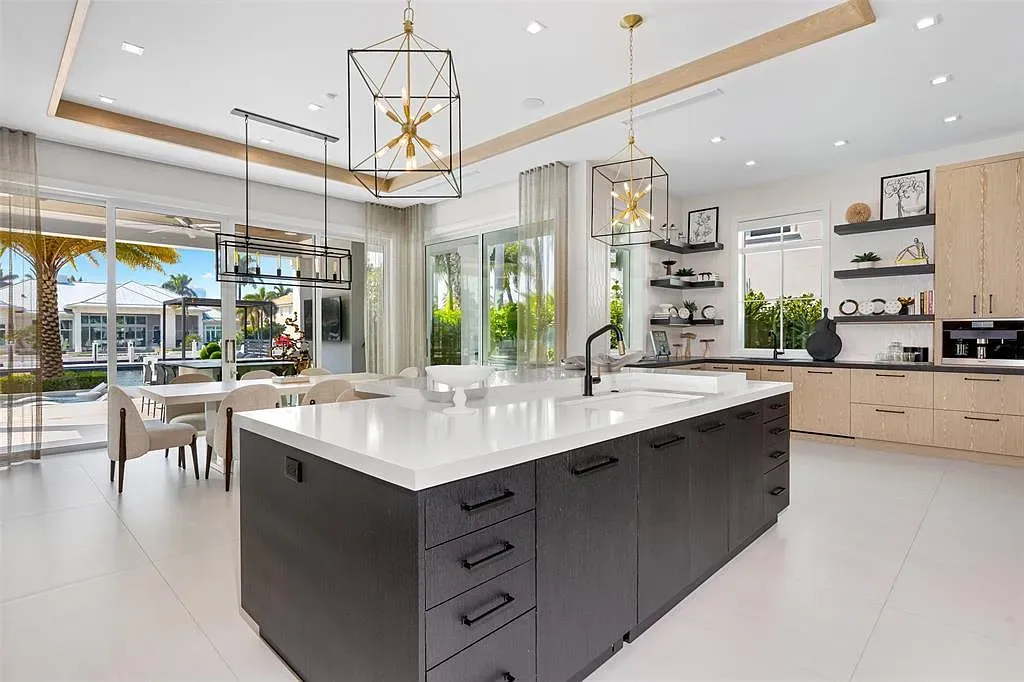 Ultra Luxury $28.4 Million Waterfront Estate Offering Exceptional Coastal Living in Fort Lauderdale 9 Luxurious waterfront exterior view of the modern estate at 2520 Del Lago Dr in Fort Lauderdale, showcasing the canal frontage, heated pool, and contemporary architectural design.