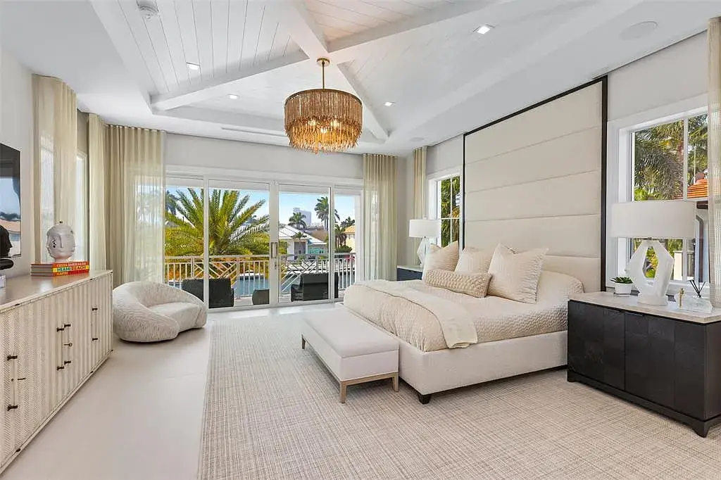Ultra Luxury $28.4 Million Waterfront Estate Offering Exceptional Coastal Living in Fort Lauderdale 14 Luxurious waterfront exterior view of the modern estate at 2520 Del Lago Dr in Fort Lauderdale, showcasing the canal frontage, heated pool, and contemporary architectural design.