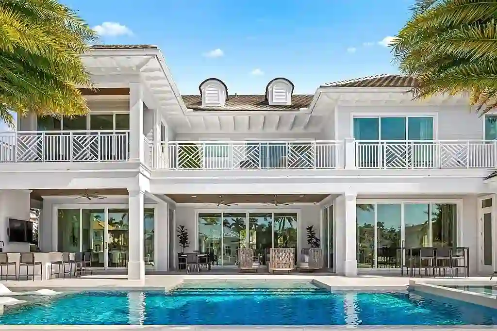 Ultra Luxury $28.4 Million Waterfront Estate Offering Exceptional Coastal Living in Fort Lauderdale 17 Luxurious waterfront exterior view of the modern estate at 2520 Del Lago Dr in Fort Lauderdale, showcasing the canal frontage, heated pool, and contemporary architectural design.