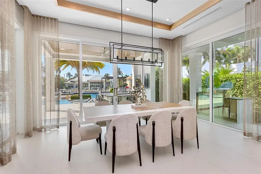 Ultra Luxury $28.4 Million Waterfront Estate Offering Exceptional Coastal Living in Fort Lauderdale 10 Luxurious waterfront exterior view of the modern estate at 2520 Del Lago Dr in Fort Lauderdale, showcasing the canal frontage, heated pool, and contemporary architectural design.