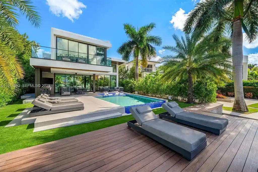Exquisite $16.9 Million Modern Waterfront Estate in North Miami Beach Offers Unmatched Luxury and Elegance 17 Interior view of 342 S Pkwy showcasing open-plan living area, Mia Cucina kitchen, and luxury limestone flooring