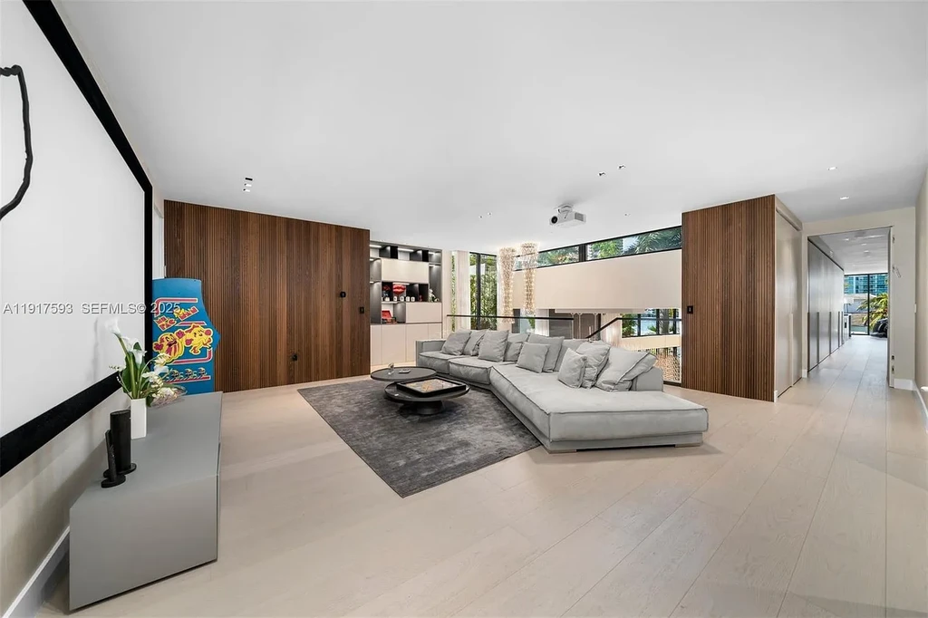 Exquisite $16.9 Million Modern Waterfront Estate in North Miami Beach Offers Unmatched Luxury and Elegance 15 Interior view of 342 S Pkwy showcasing open-plan living area, Mia Cucina kitchen, and luxury limestone flooring