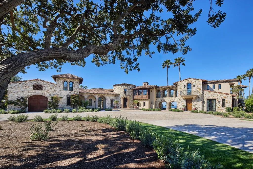 Oceanfront Masterwork Listed at 43 Million Presents One of Southern California’s Most Extraordinary Blufftop Estates 3 Front elevation of the Mediterranean estate at 4130 Calle Isabella in San Clemente featuring stone facades, arched loggias, terracotta roofs, and mature coastal landscaping.