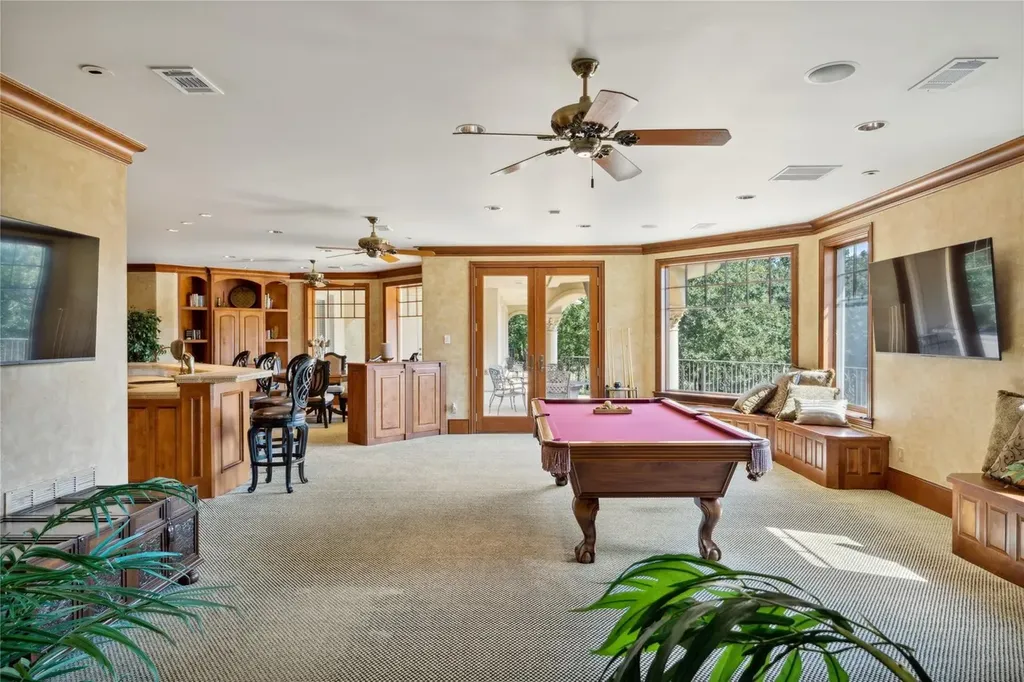 A $6.975 Million Steel Framed Estate Anchors Tour 18’s Most Enduring Address 8 Game room with pool table and built in bar at 5700 Masters Ct in Flower Mound, Texas