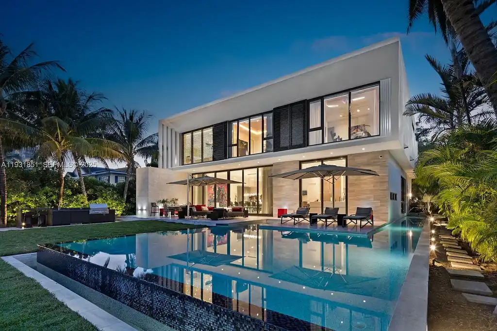 A $26 Million Tropical Modern Waterfront Estate Redefining Private Island Living in Miami Beach 5 Exterior of 6411 Allison Rd, a $26 million tropical modern home in Miami Beach with floor-to-ceiling glass