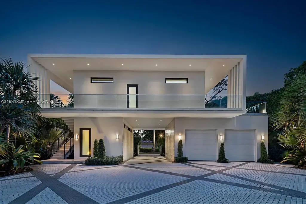 A $26 Million Tropical Modern Waterfront Estate Redefining Private Island Living in Miami Beach 16 Exterior of 6411 Allison Rd, a $26 million tropical modern home in Miami Beach with floor-to-ceiling glass