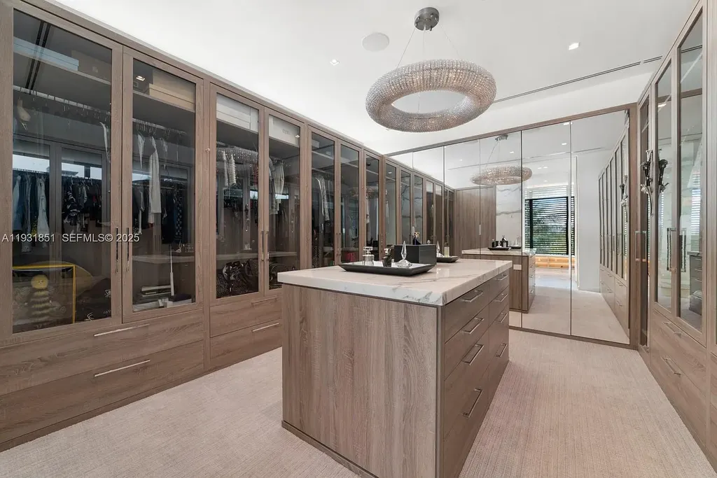 A $26 Million Tropical Modern Waterfront Estate Redefining Private Island Living in Miami Beach 11 Exterior of 6411 Allison Rd, a $26 million tropical modern home in Miami Beach with floor-to-ceiling glass