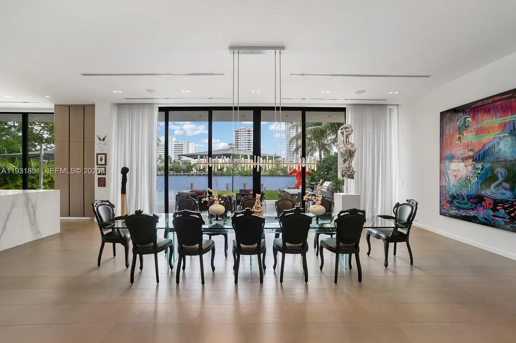 A $26 Million Tropical Modern Waterfront Estate Redefining Private Island Living in Miami Beach 9 Exterior of 6411 Allison Rd, a $26 million tropical modern home in Miami Beach with floor-to-ceiling glass