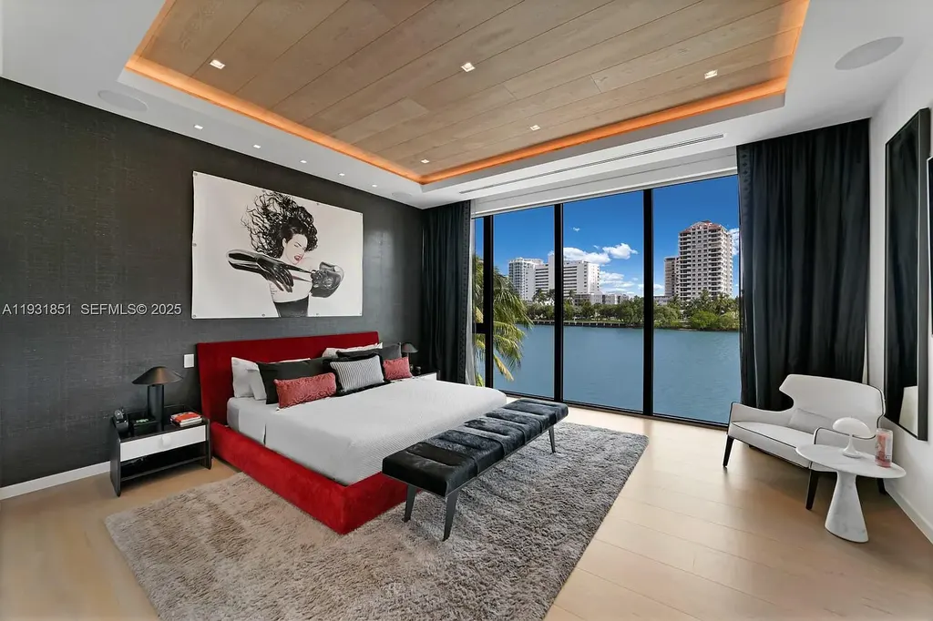 A $26 Million Tropical Modern Waterfront Estate Redefining Private Island Living in Miami Beach 12 Exterior of 6411 Allison Rd, a $26 million tropical modern home in Miami Beach with floor-to-ceiling glass