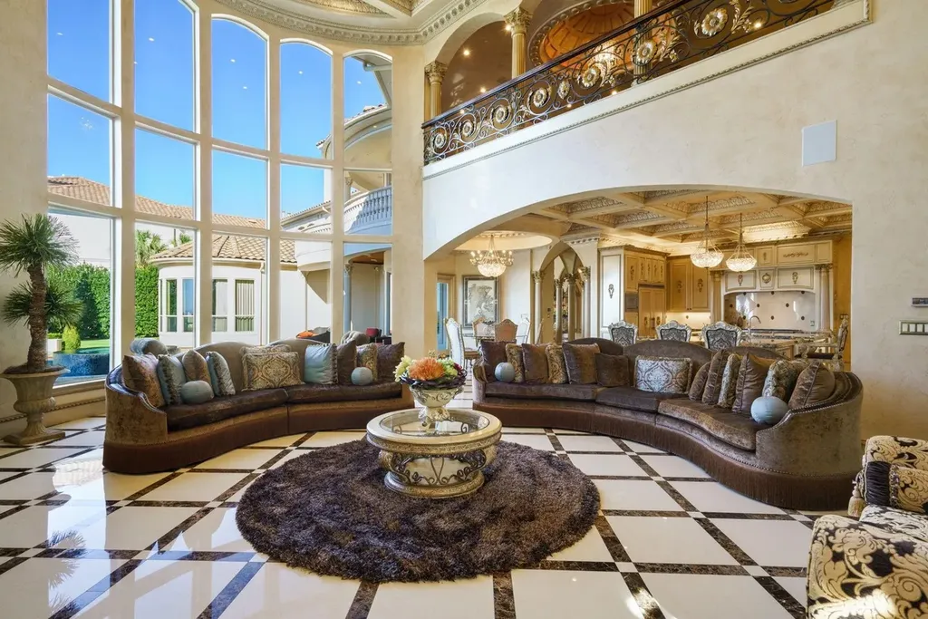 A Venetian Inspired Plano Estate Lists for 7.5 Million as a Rare Architectural Masterpiece in Kings Gate 4 Great room inside the Venetian inspired estate at 6509 Sudbury Rd in Plano featuring soaring windows curved seating marble floors and ornate architectural details.