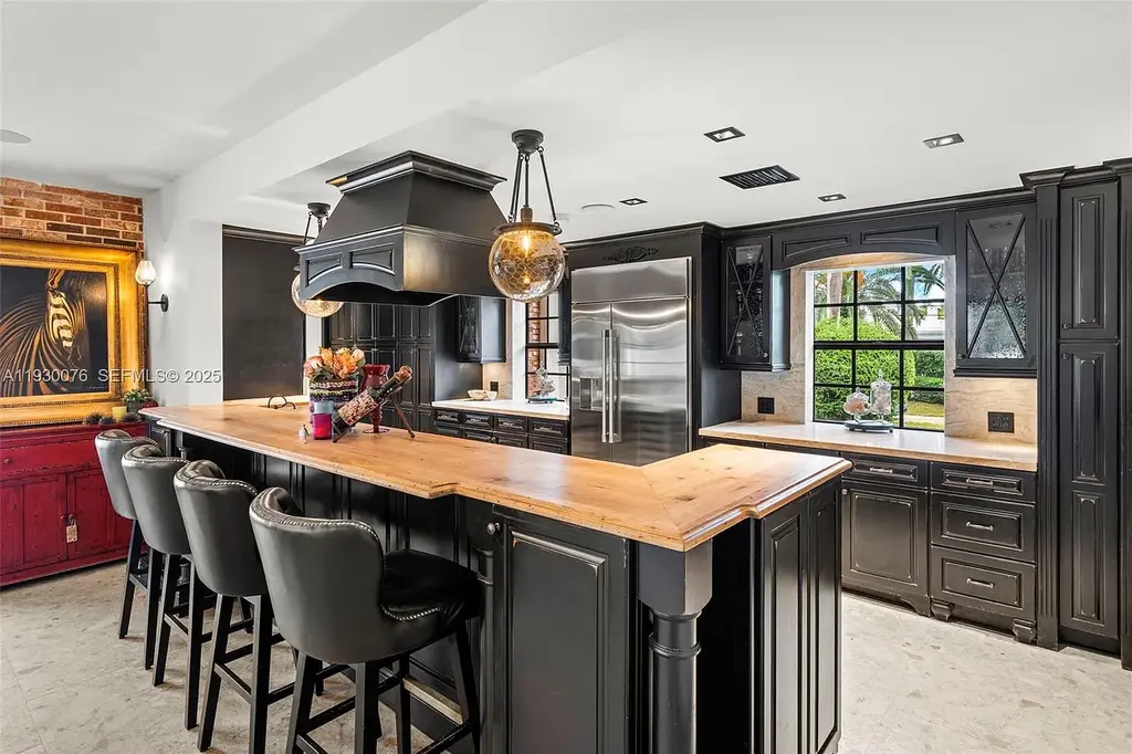 Exceptional $25 Million Waterfront Estate in One of Miami’s Most Exclusive Gated Island Enclaves 9 Waterfront luxury home at 980 Belle Meade Island Dr featuring a private pool and 120 feet of canal frontage in Miami