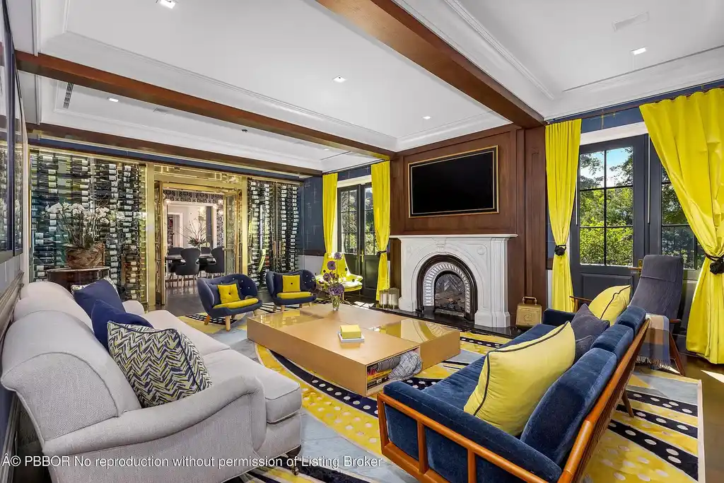 $26.9 Million North End Palm Beach Estate With Guest House and Resort-Style Grounds 8 Front exterior of 1053 N Lake Way, a luxury Palm Beach home for sale featuring Bermuda-style architecture and lush tropical landscaping.