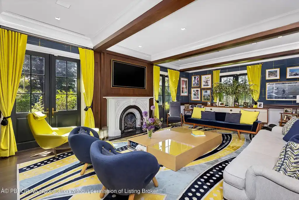 $26.9 Million North End Palm Beach Estate With Guest House and Resort-Style Grounds 7 Front exterior of 1053 N Lake Way, a luxury Palm Beach home for sale featuring Bermuda-style architecture and lush tropical landscaping.