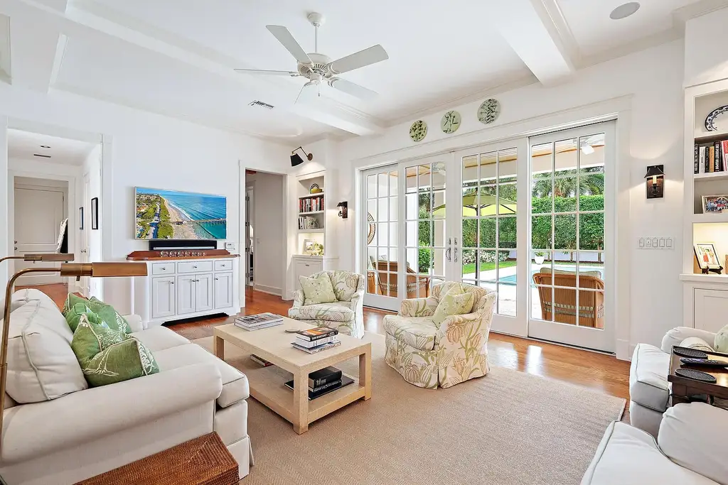 Stunning New Garden Estate in Hobe Sound Hits the Market for $5.5 Million 8 Bright living room with garden views inside 11726 SE Laurel Lane, a luxury home in Hobe Sound