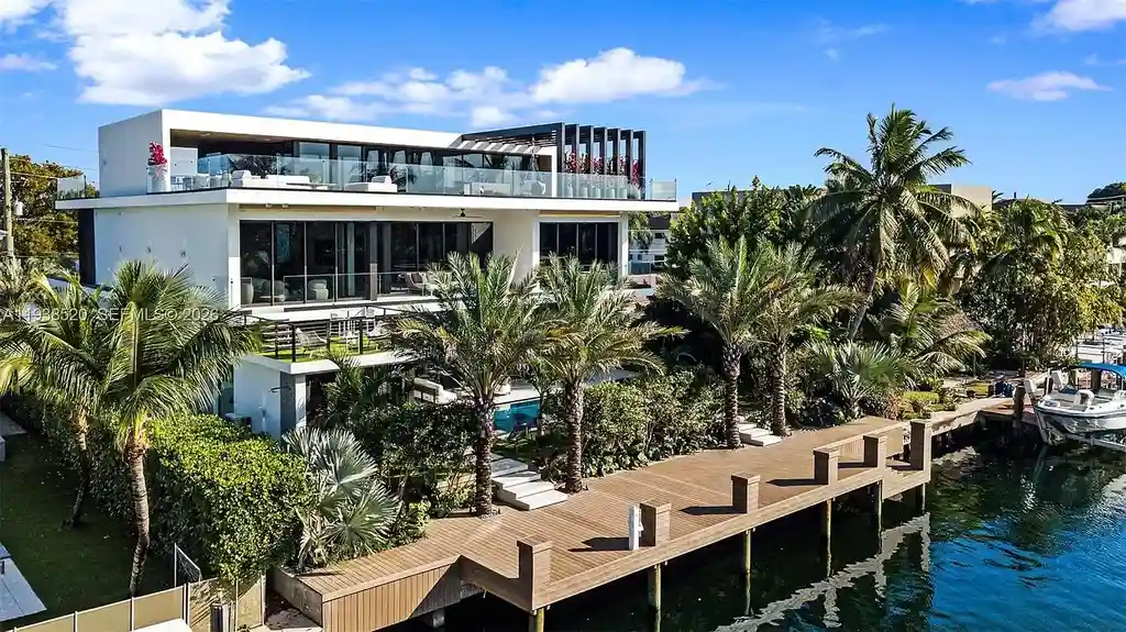 $13.9 Million Exceptional Waterfront Estate Sets a New Benchmark for Luxury Living in North Miami 5 Canal-front view of a luxury home in North Miami for sale with 75 feet of direct water frontage.