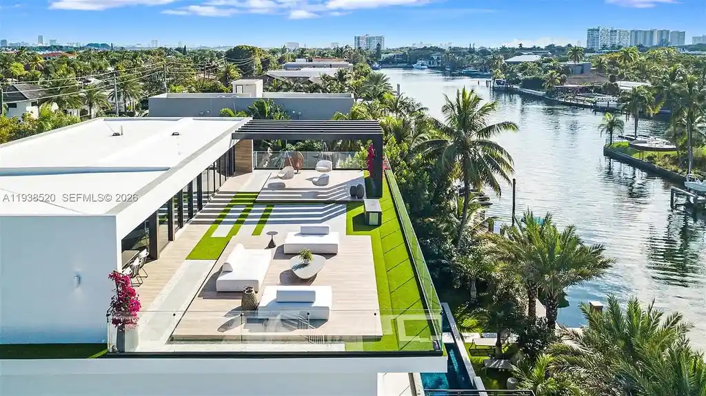 $13.9 Million Exceptional Waterfront Estate Sets a New Benchmark for Luxury Living in North Miami 16 Canal-front view of a luxury home in North Miami for sale with 75 feet of direct water frontage.