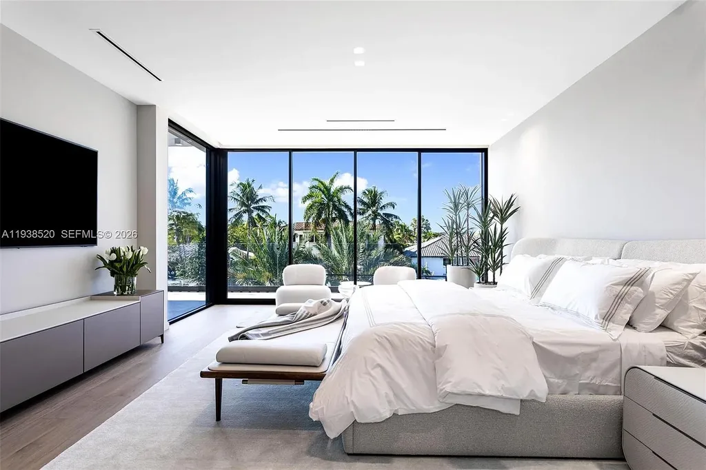 $13.9 Million Exceptional Waterfront Estate Sets a New Benchmark for Luxury Living in North Miami 11 Canal-front view of a luxury home in North Miami for sale with 75 feet of direct water frontage.