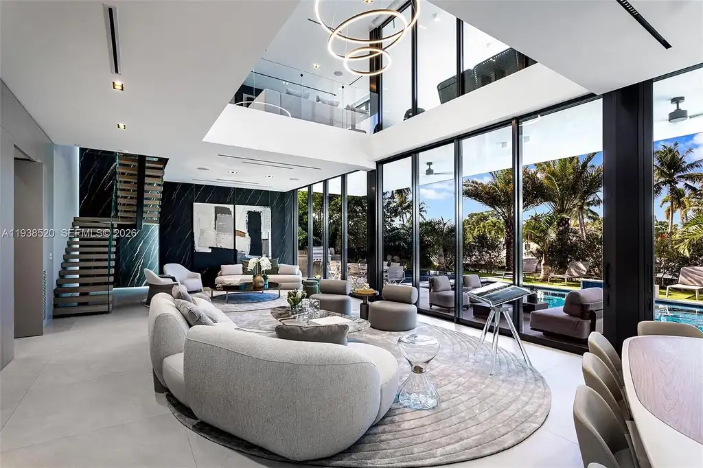 $13.9 Million Exceptional Waterfront Estate Sets a New Benchmark for Luxury Living in North Miami 7 Canal-front view of a luxury home in North Miami for sale with 75 feet of direct water frontage.