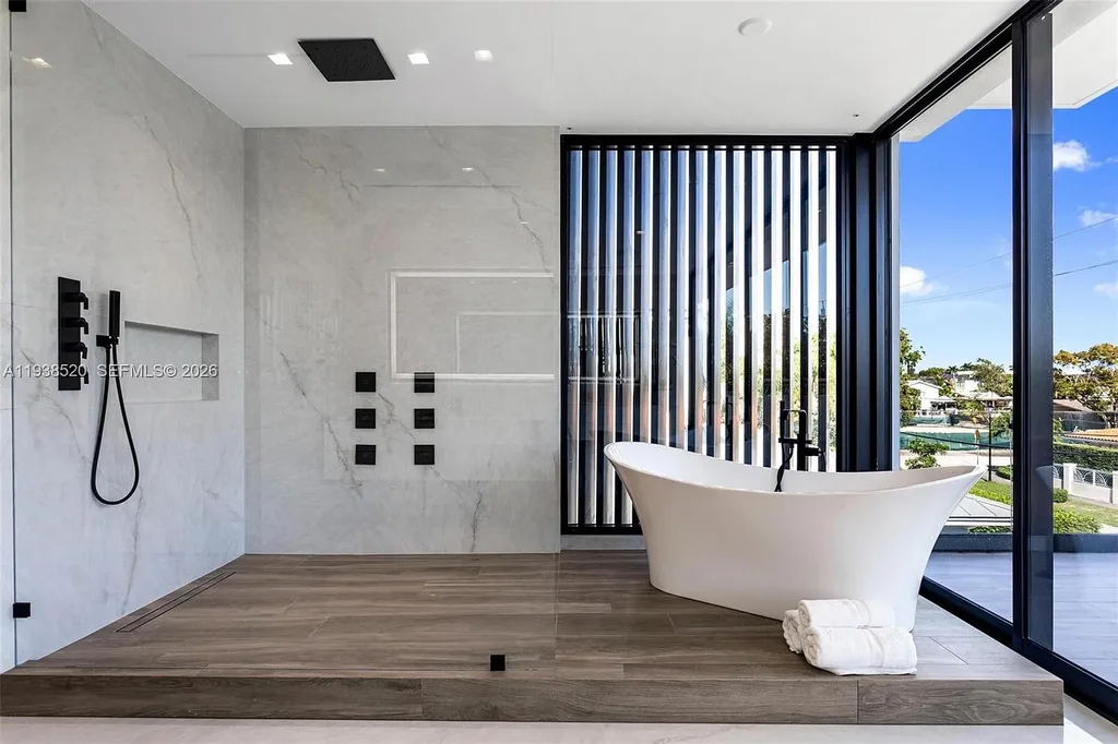 $13.9 Million Exceptional Waterfront Estate Sets a New Benchmark for Luxury Living in North Miami 12 Canal-front view of a luxury home in North Miami for sale with 75 feet of direct water frontage.