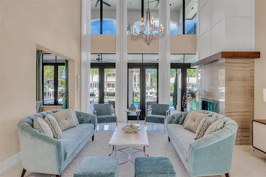 $9.9 Million Architectural Masterpiece Redefining Waterfront Luxury in Fort Lauderdale 7 Contemporary interior design featuring floor-to-ceiling glass at a Fort Lauderdale luxury residence