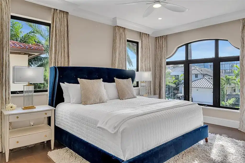 $9.9 Million Architectural Masterpiece Redefining Waterfront Luxury in Fort Lauderdale 14 Contemporary interior design featuring floor-to-ceiling glass at a Fort Lauderdale luxury residence