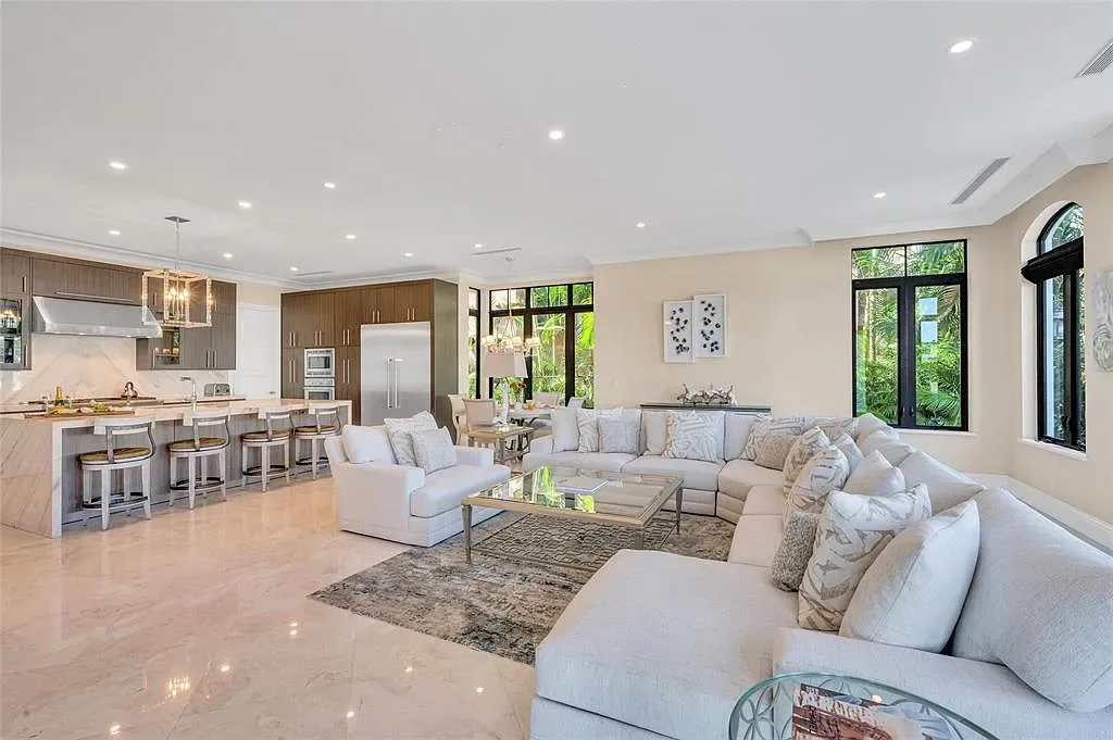 $9.9 Million Architectural Masterpiece Redefining Waterfront Luxury in Fort Lauderdale 8 Contemporary interior design featuring floor-to-ceiling glass at a Fort Lauderdale luxury residence