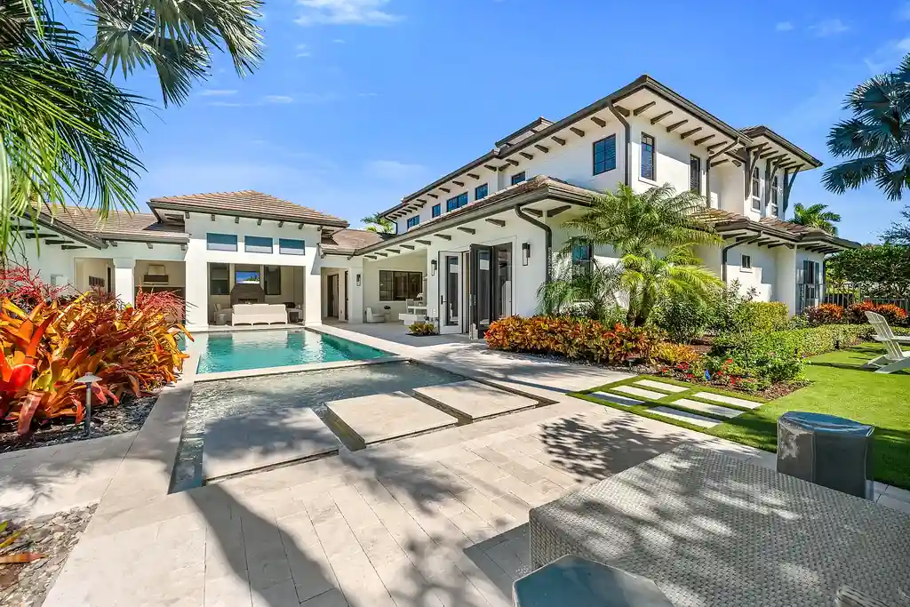 Stunning $8.4 Million Moorings Masterpiece Showcases Timeless Luxury Living in Naples 15 Front exterior of 2025 Crayton RD, a $8.395M custom luxury home in The Moorings, Naples Real Estate