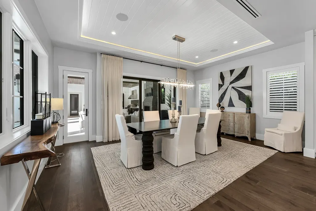 Stunning $8.4 Million Moorings Masterpiece Showcases Timeless Luxury Living in Naples 9 Front exterior of 2025 Crayton RD, a $8.395M custom luxury home in The Moorings, Naples Real Estate