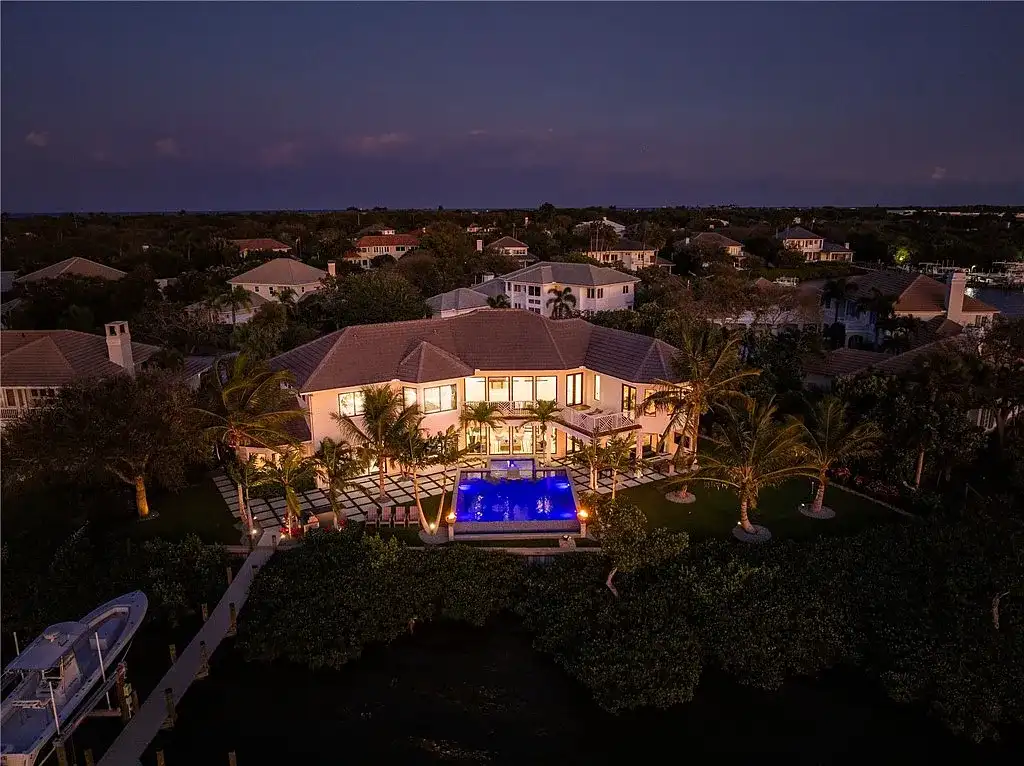 $6 Million Riverfront Estate in Vero Beach Offers Resort-Style Living and Rare Privacy 15 Riverfront exterior view of 225 Osprey Ct in Vero Beach showcasing tropical modern architecture and 175 feet of waterfront frontage