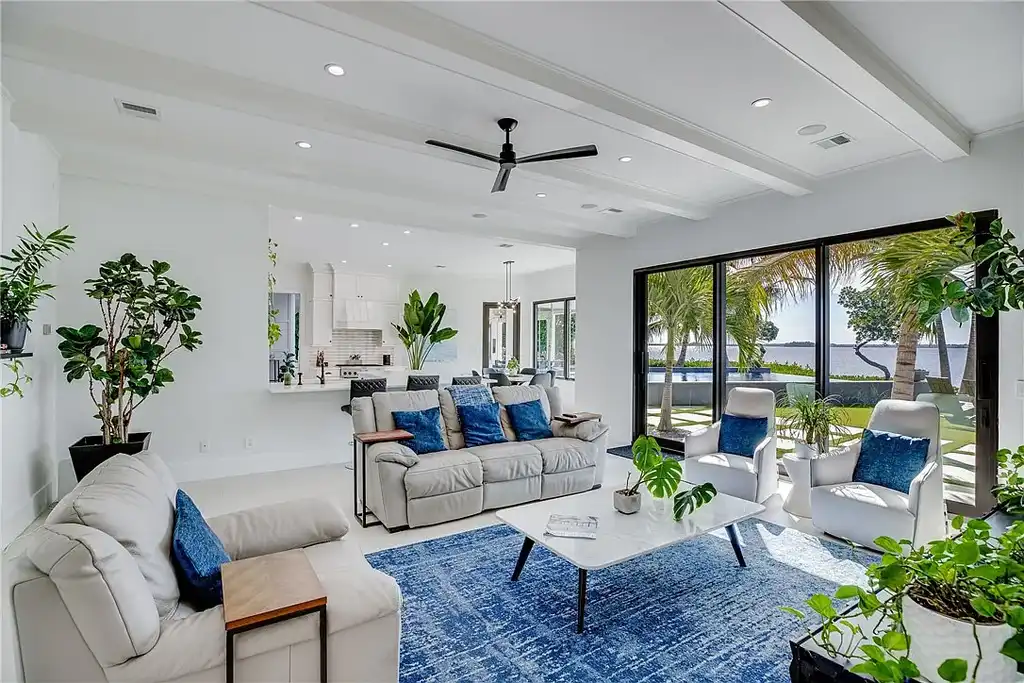 $6 Million Riverfront Estate in Vero Beach Offers Resort-Style Living and Rare Privacy 7 Riverfront exterior view of 225 Osprey Ct in Vero Beach showcasing tropical modern architecture and 175 feet of waterfront frontage