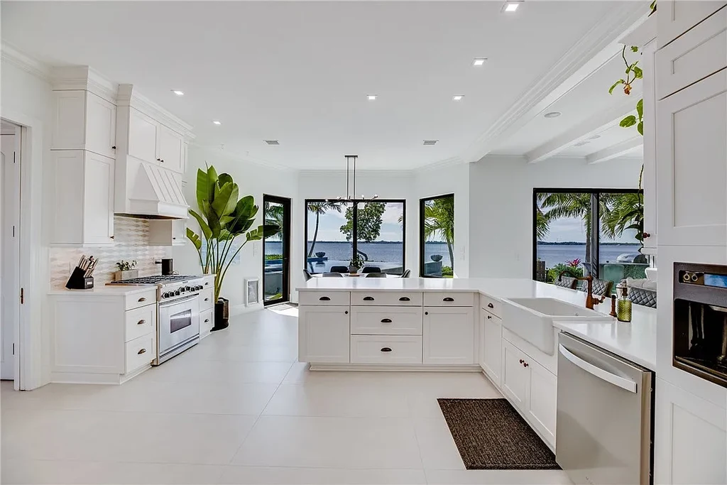 $6 Million Riverfront Estate in Vero Beach Offers Resort-Style Living and Rare Privacy 8 Riverfront exterior view of 225 Osprey Ct in Vero Beach showcasing tropical modern architecture and 175 feet of waterfront frontage