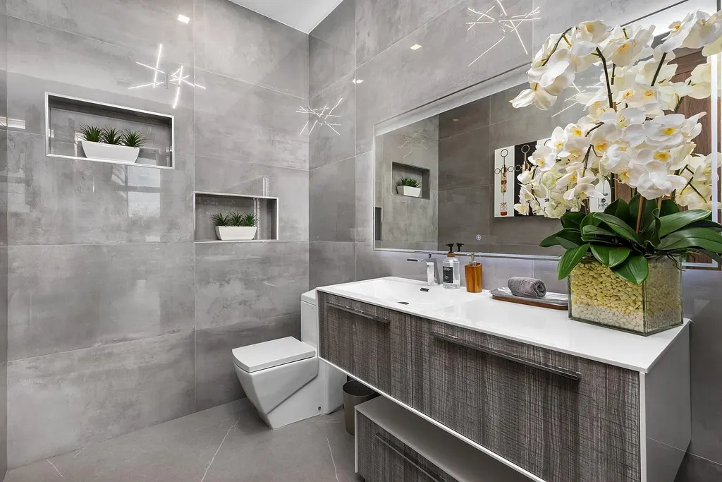 $10 Million Stunning Contemporary Estate Redefining Luxury Living in Fort Lauderdale 17 Modern kitchen at 2301 NE 37th Drive highlighting walnut cabinetry and refined stone surfaces