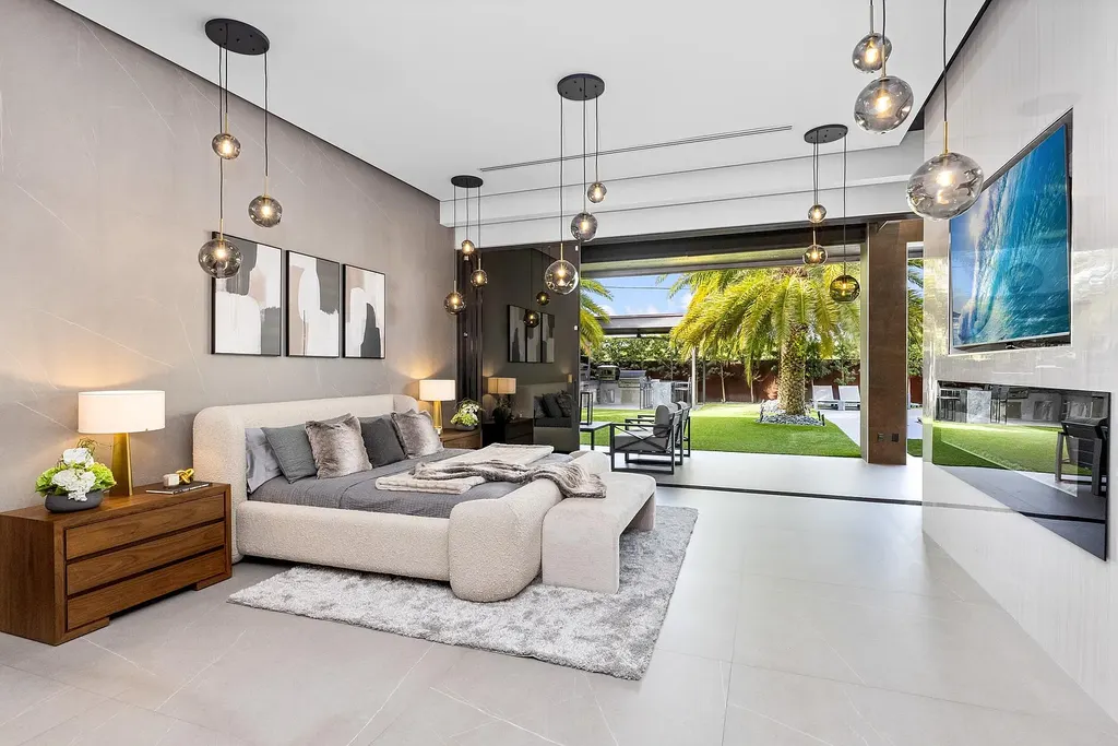 $10 Million Stunning Contemporary Estate Redefining Luxury Living in Fort Lauderdale 16 Modern kitchen at 2301 NE 37th Drive highlighting walnut cabinetry and refined stone surfaces