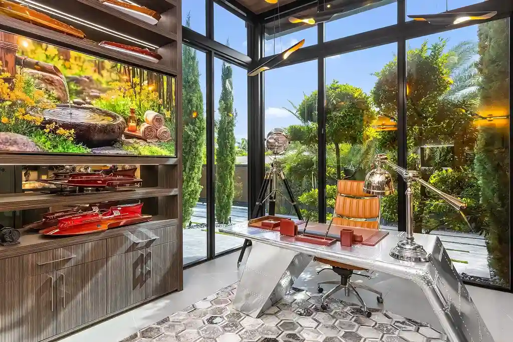 $10 Million Stunning Contemporary Estate Redefining Luxury Living in Fort Lauderdale 11 Modern kitchen at 2301 NE 37th Drive highlighting walnut cabinetry and refined stone surfaces